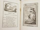 an open book with a picture of a man and a dog
