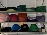 many hats on the shelves in the store