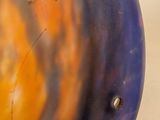 a close up of a glass object with a hole in it