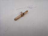a small piece of metal on a white surface