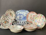 a lot of plates that are sitting on a table
