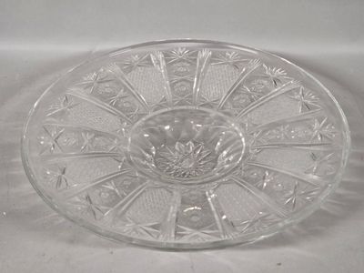a clear glass bowl with a flower design on it