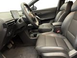 the interior of a car with a steering wheel, dashboard, and center console