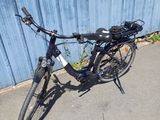 a bike that is parked next to a blue building
