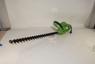 a green hedger that is sitting on a table