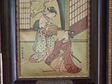 tableau représentant une femme en kimono assise par terre près d'un mur rouge