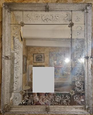 a mirror hanging on the wall in a room