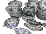 a lot of plates and bowls that are sitting on a table