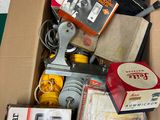 a box full of assorted items sitting on the floor