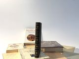 a stack of books sitting on top of each other on a table