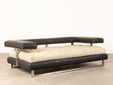 an image of a black and white couch in a room