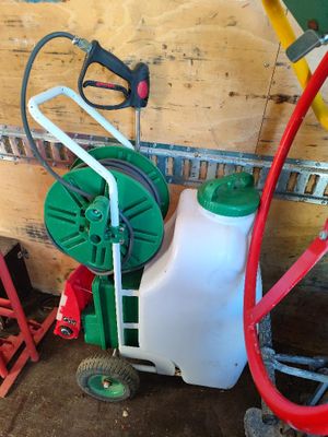 a picture of a green and white sprayer next to a red and white hose