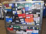 a metal cart with many boxes of cigarettes on top of it