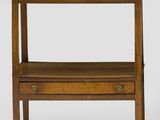 a small wooden table with two drawers and a shelf