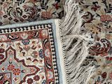 an image of a rug with fringes laying on top of it