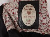 a close up of a jacket with a picture of a rose garden on it