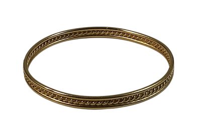 a close up of a gold bracelet on a white background