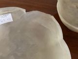 two bowls sitting on a table with a label on them