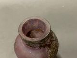 a small vase that is sitting on a table