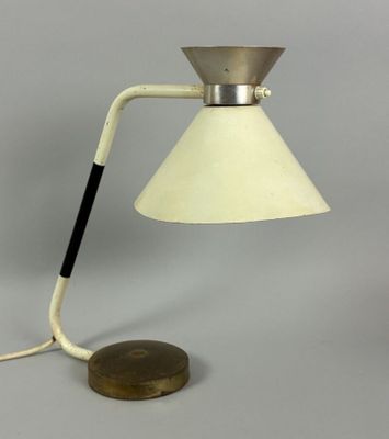 a white table lamp with a wooden base and a white shade