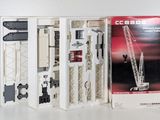 a boxed picture of a model of a crane in a box