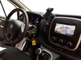 the interior of a car with a steering wheel and dashboard controls