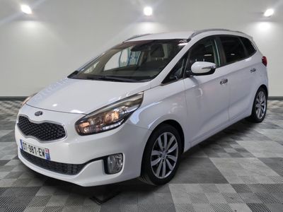 the white car is parked on a checkered floor in the garage