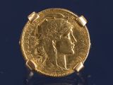 l'image d'une pièce d'or sur laquelle figure le visage d'une femme