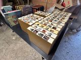 a lot of books on a table in a room