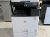 a printer that is sitting on the floor in a room