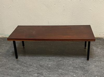 a brown table with black legs and a brown table top