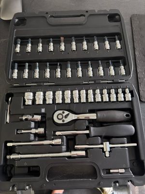 a black case with tools in it sitting on a table
