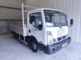 a white truck that is parked in a garage