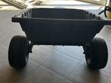 a black cart that is sitting in the middle of the floor