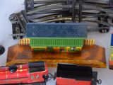 many toy trains that are on the table together