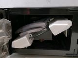 a microwave that has a bunch of wires inside of it
