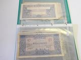 two old bank notes in a clear plastic case
