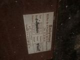 a close up of a metal door with a sticker on it