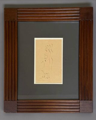 a framed drawing of a woman sitting on a chair in front of a gray wall