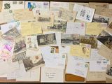 a suitcase full of letters and postcards sitting on a table