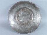 a silver plate that is sitting on a table