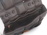 brown leather purse with multiple compartments on white background on white surface