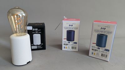 three different types of light bulbs on the table