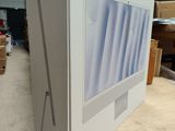 a computer monitor sitting on top of a cardboard box