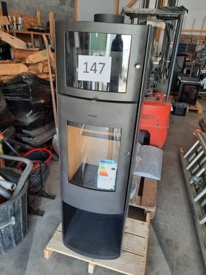 a picture of a stove in a warehouse with a sign on it