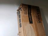 a cardboard box that is sitting on top of a wall