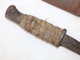 a knife that has been wrapped up and is sitting on a table