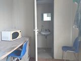 a microwave and a microwave oven on a table in a room