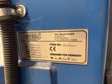 a label on the side of a machine that is blue