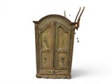 an old wooden cabinet with antlers on it